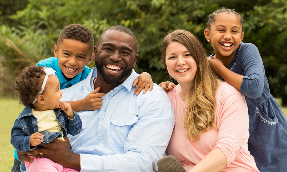 Happy Diverse Family With Kids Smiling Outdoors Mobile