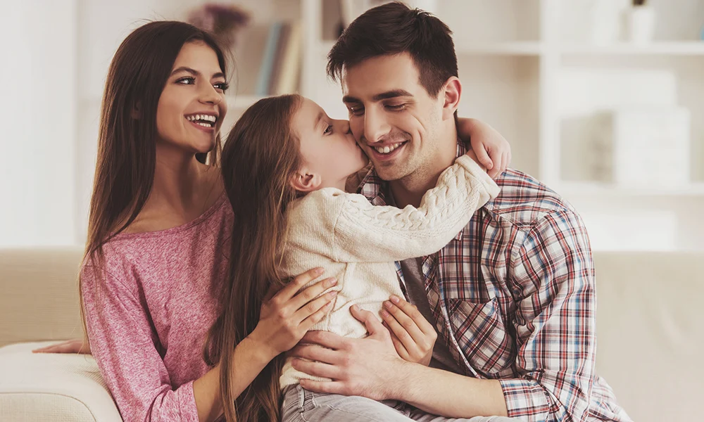 Happy Family On The Couch Mobile