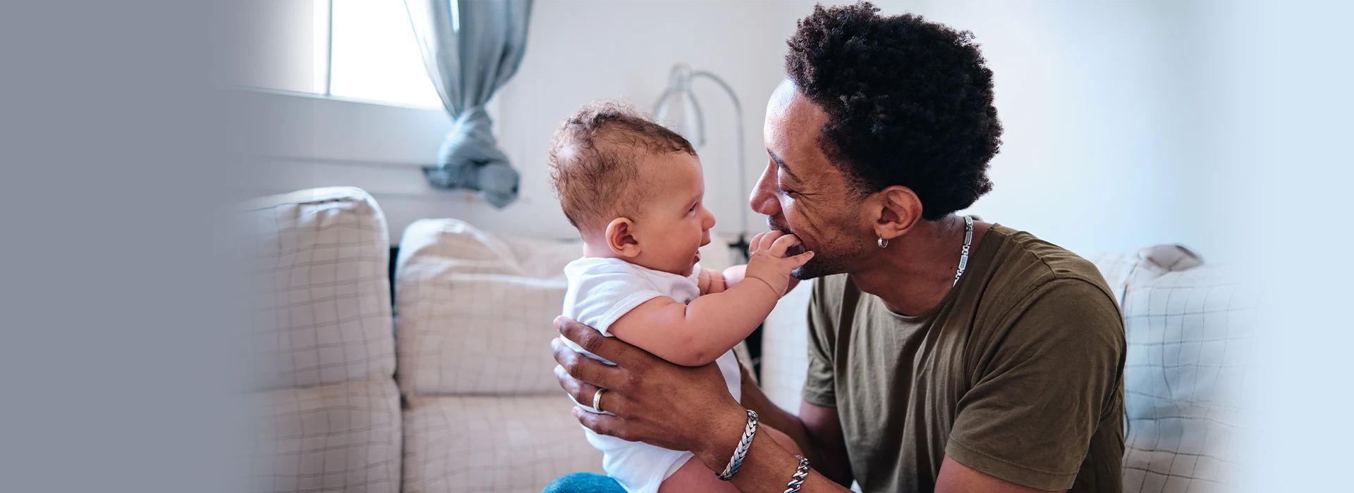 Dad With Child On Couch